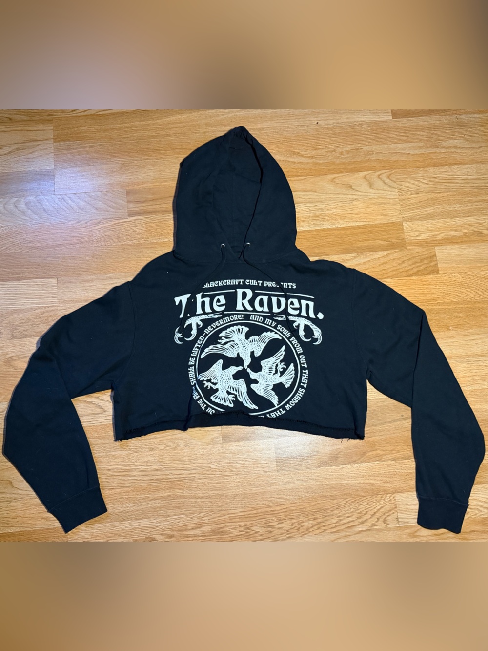 The Raven Black Cropped Hoodie with Graphic Print